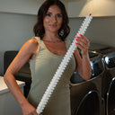 Spiral lint catching brush for dryer traps